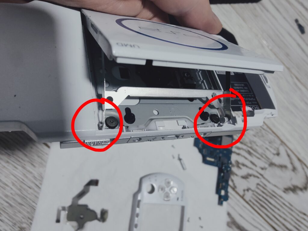 PSP 300 with open disk bay. Process of PSP reshell