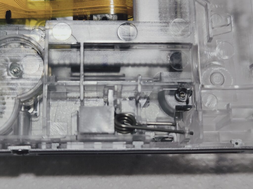 Spring of PSP's disk bay's cover. Process of PSP reshell