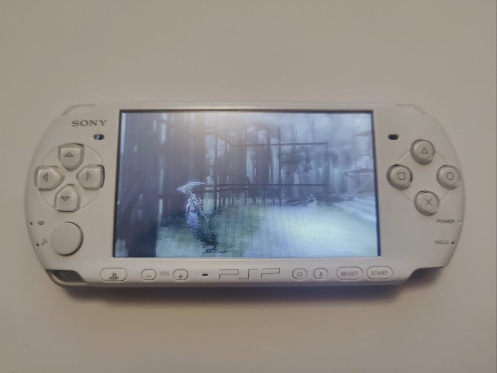 Photo of PSP 3000 running a game